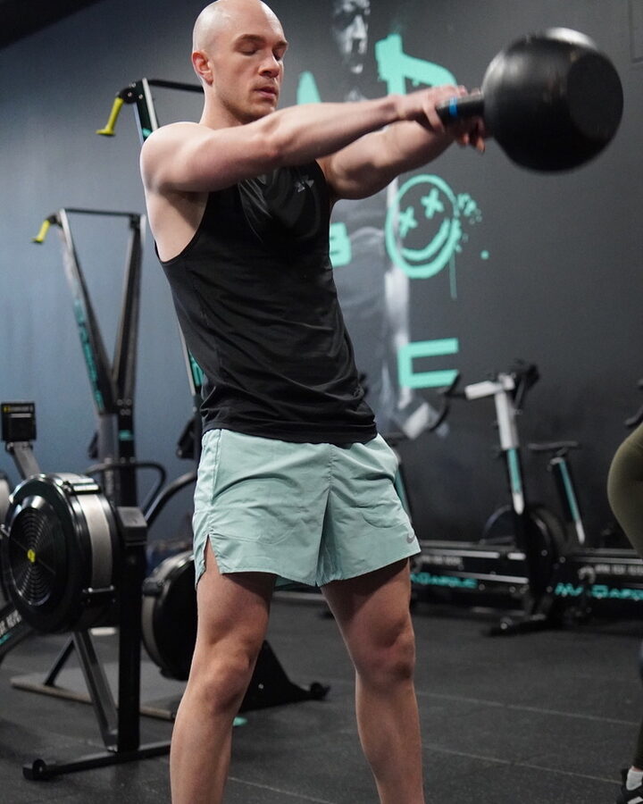 Matt Katawicz swinging a kettlebell during a class at MADabolic.