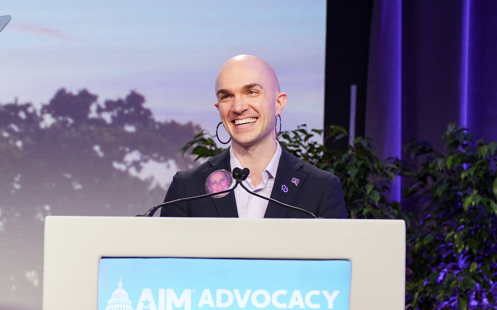 Matt Katawicz speaking at a podium at an Alzheimer's Association advocacy forum.